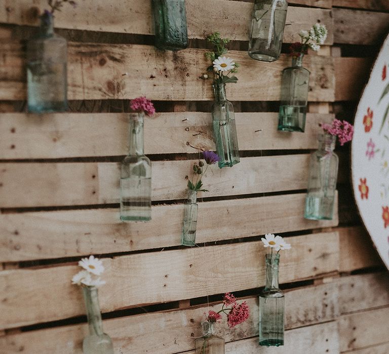 DIY Wooden Palette &amp; Bottle Wedding Decor | English Country Garden Marquee Wedding at the Family Home on the Isle of Wight | Jason Mark Harris Photography