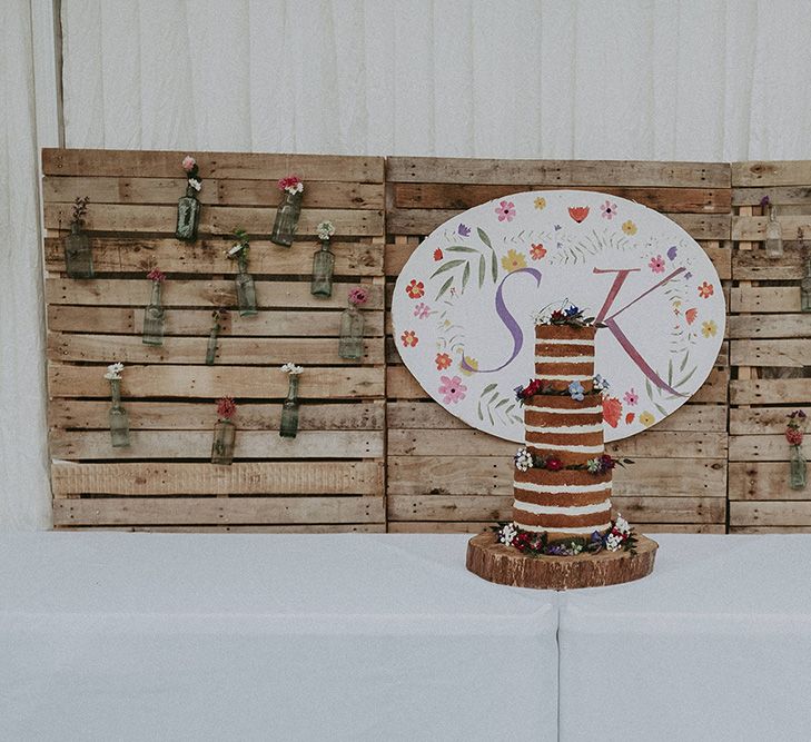 Cake Table with Rustic DIY Backdrop Wedding Decor | English Country Garden Marquee Wedding at the Family Home on the Isle of Wight | Jason Mark Harris Photography