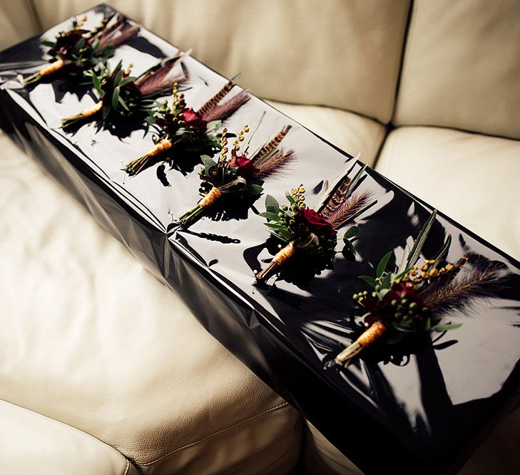 Box of Groomsmen Buttonholes with Foliage, Red Rose and Pheasant Feather