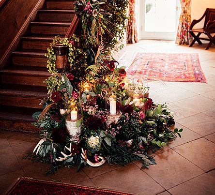 Staircase Wedding Floral Arrangement with Foliage, Red Flowers, Pampas Grass and Pheasant Feathers