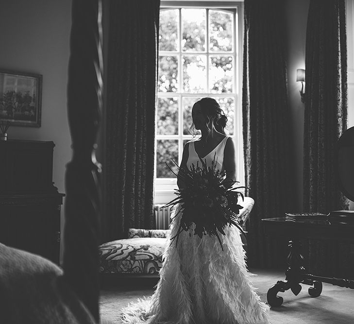 Black &amp; White Portrait of Bride on Wedding Morning in her Charlie Brear Payton Bridal Gown &amp; Piora Feather Skirt