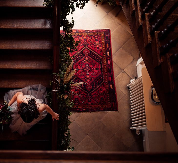 Bridesmaid Walking Down The Stair at Iscoyd Park Wedding Venue