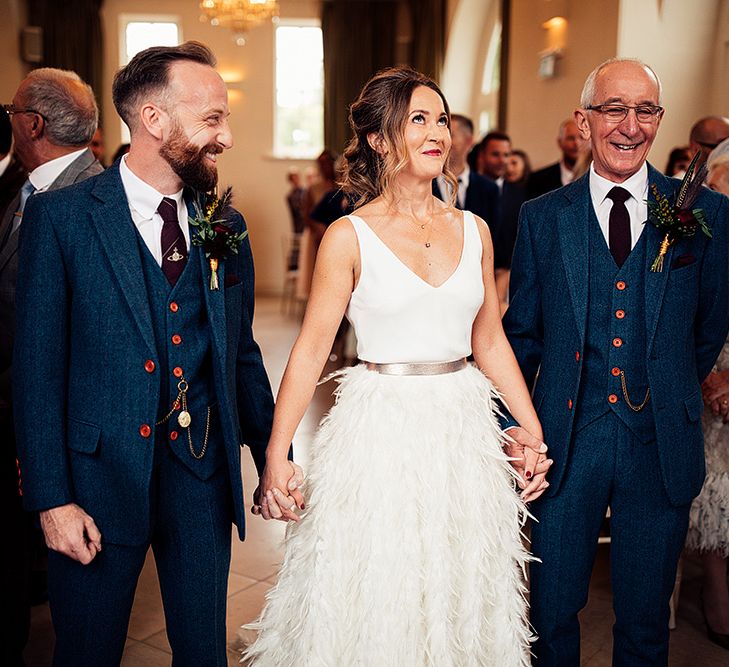 Bride in Charlie Brear Payton Bridal Gown &amp; Piora Feather Skirt at The Altar with Her Groom and Father