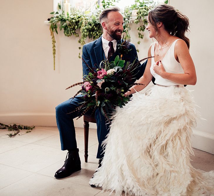 Bride in Charlie Brear Payton Bridal Gown &amp; Piora Feather Skirt and Groom in Three Piece Wool Suit