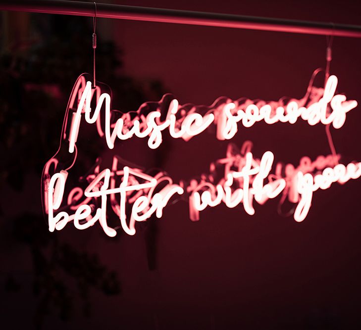 Pink Neon 'Music Sounds Better With You' Sign