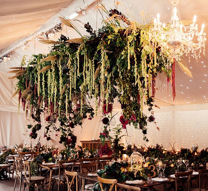 Hanging Floral Installation including Pampas Grass, Pheasant Feathers, Foliage and Red Flowers