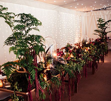 Top Table Wedding Floral Arrangement including Foliage, Red Flowers  and Candle Light