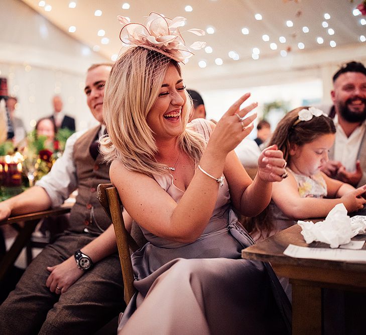 Wedding Guest Laughing During the Wedding Reception Speeches