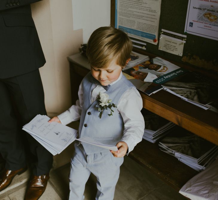 Page boy in pale blue waistcoat and trousers at Ramster Hall wedding