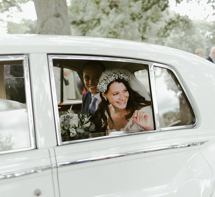 Bride and groom in wedding transport to Ramster Hall in Surrey