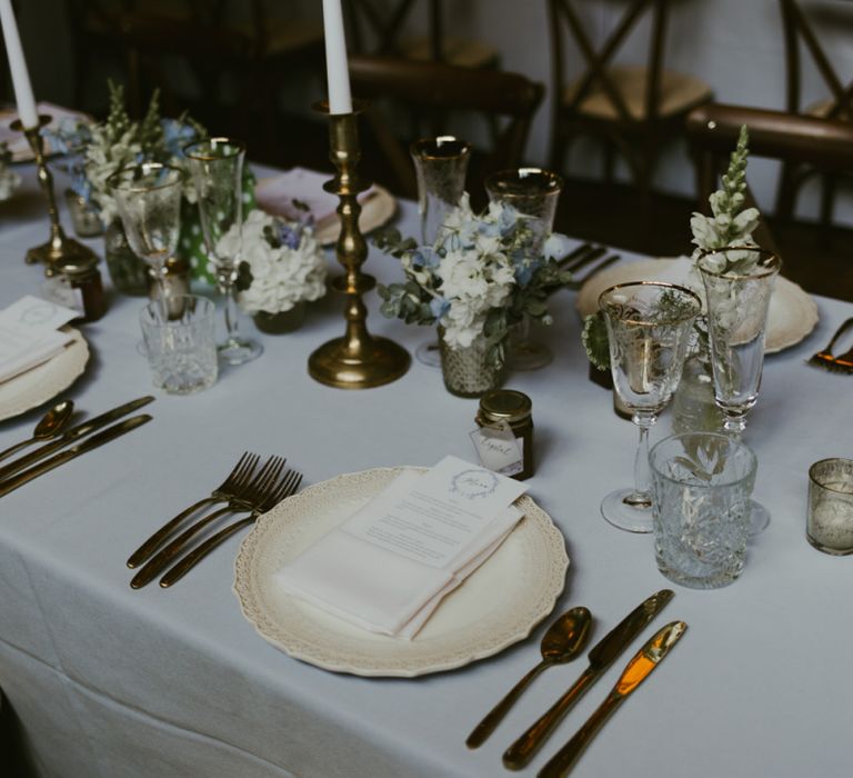 Wedding table decor with blue and white wedding flowers