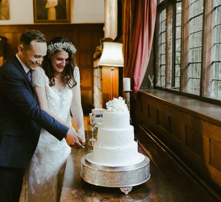 Bride and groom cut the wedding cake