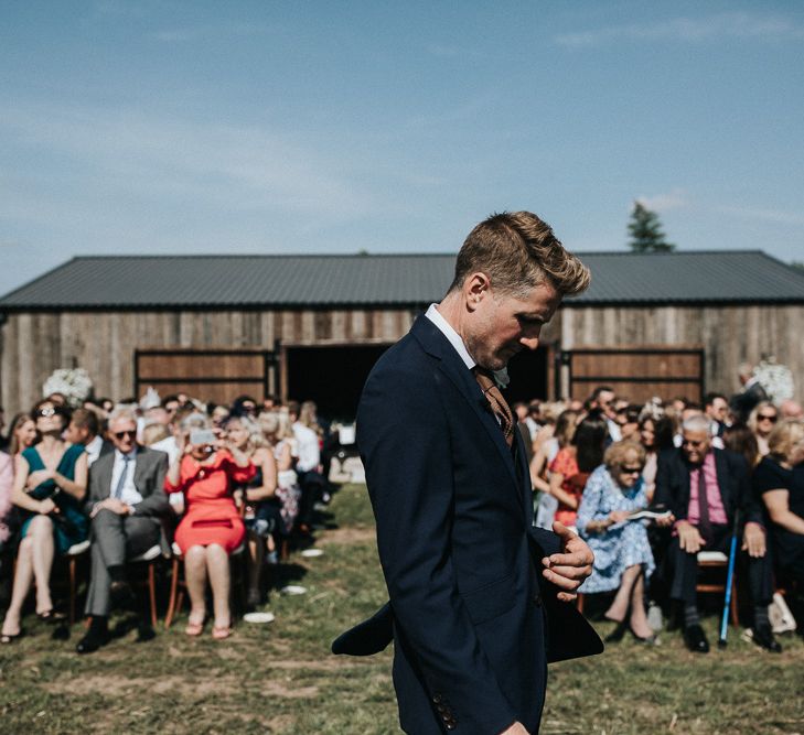 Groom Waiting at The Outdoor Wedding Ceremony Altar