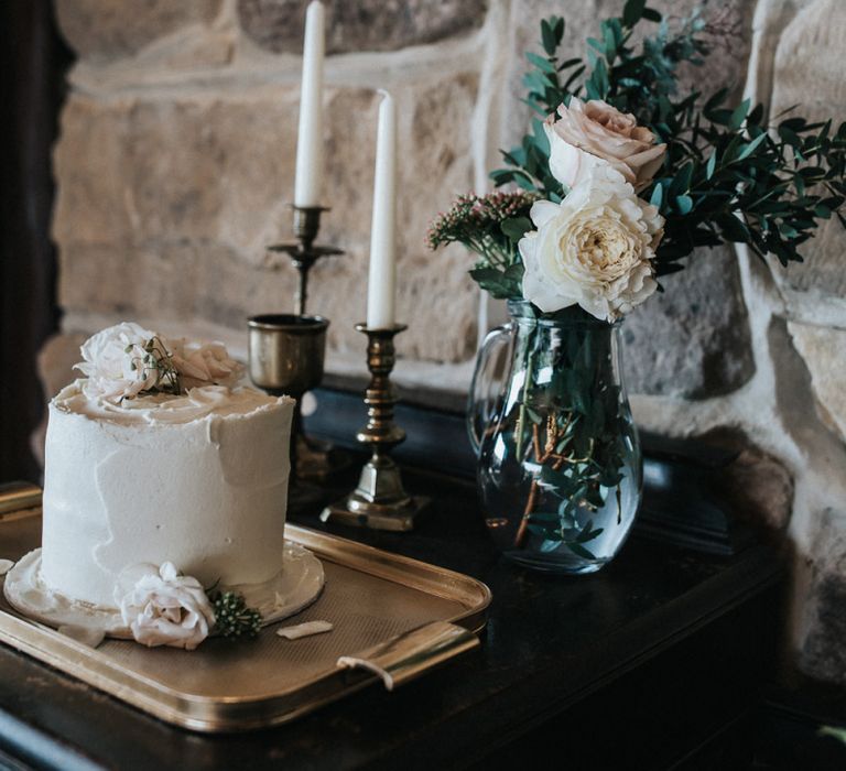 Single Tier Wedding Cake with Gold Candle Sticks and Roses in Vase