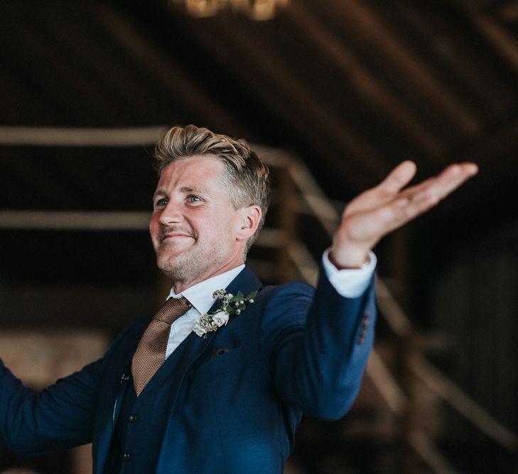 Grooms Speech wearing a Dark Navy Suit and Brown Tie