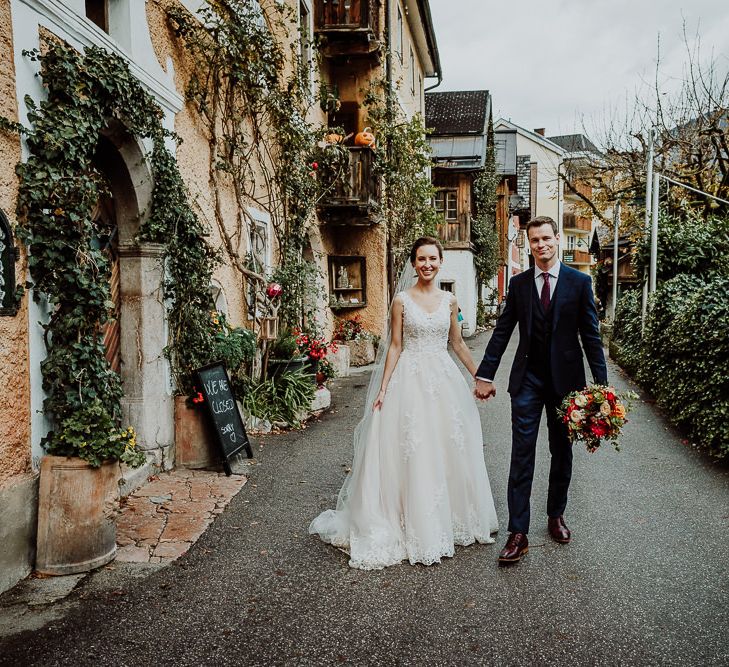 Bride and Groom Waling Down the Lane in Bride and Groom Feeding The Swans in Hallstatt, Austria