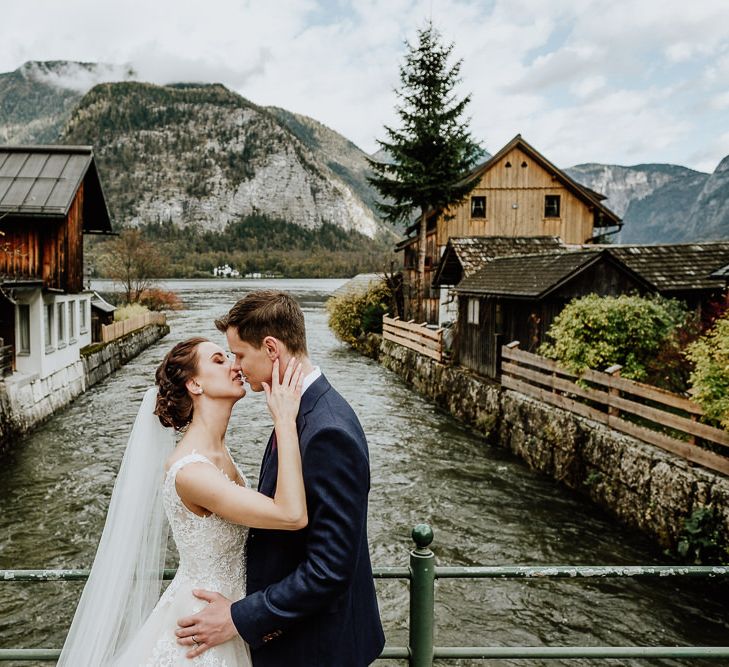 Bride and Groom Kissing on a Bridge in Hallstatt, Austria