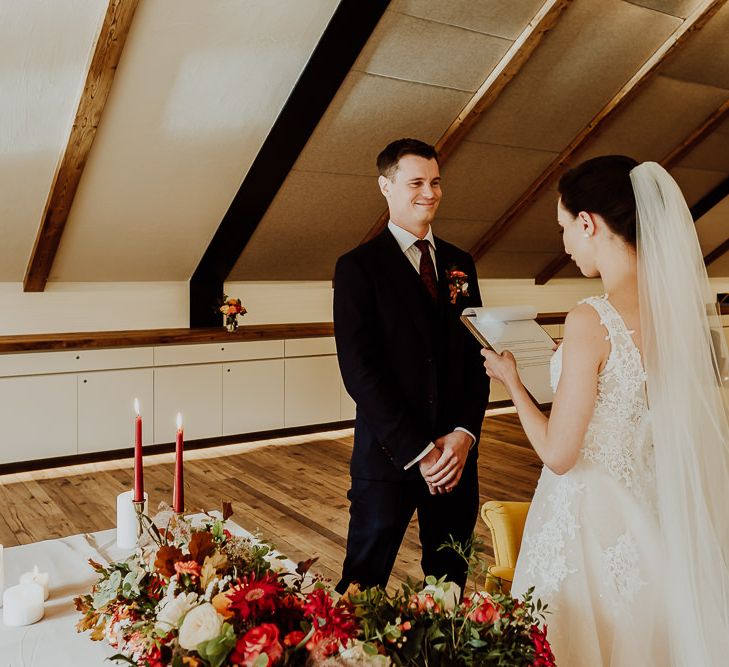 Bride Reading Her Vows To Her Groom During The Wedding Ceremony