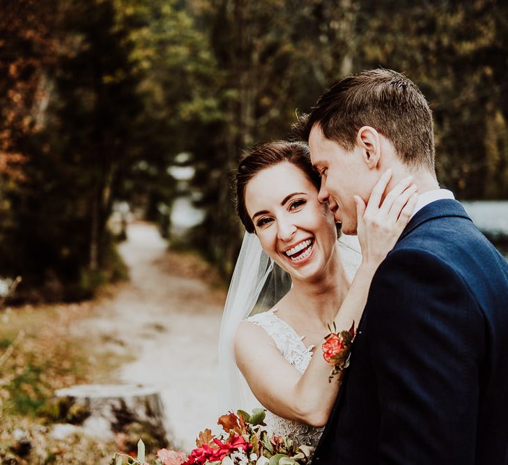 Groom Kissing his Laughing Brides Cheek