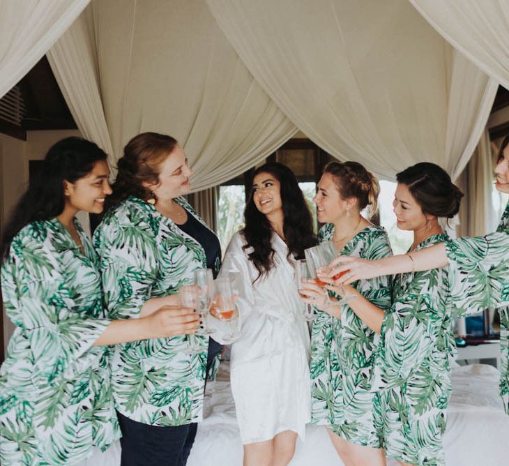 Bride and bridal party in getting ready robes before ceremony