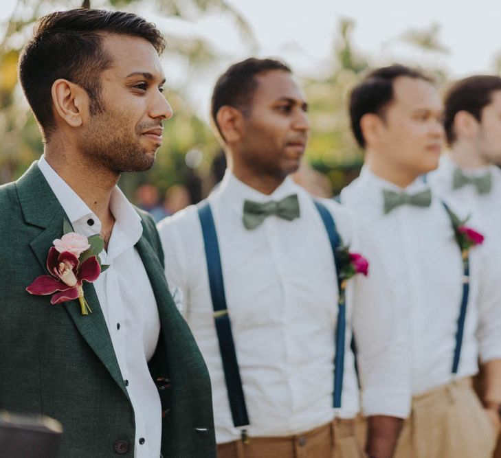 Groom and groomsmen await bride's arrival