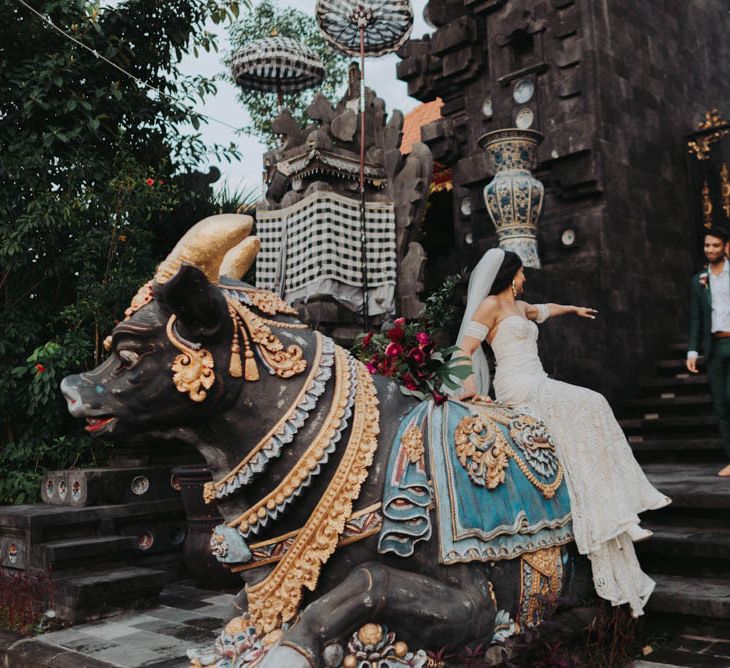 Bride and groom pose in Bali wedding venue grounds