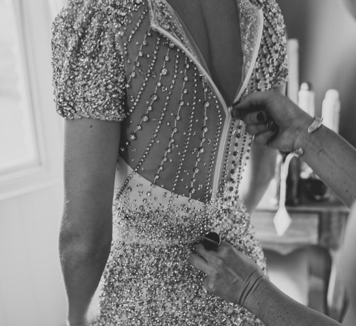 Back of brides embellished wedding dress at winter wedding with sparkles and glamour