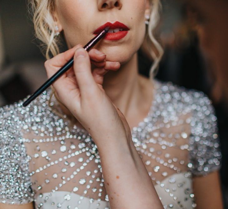 Red lip with brides embellished wedding dress for New Years eve party wedding