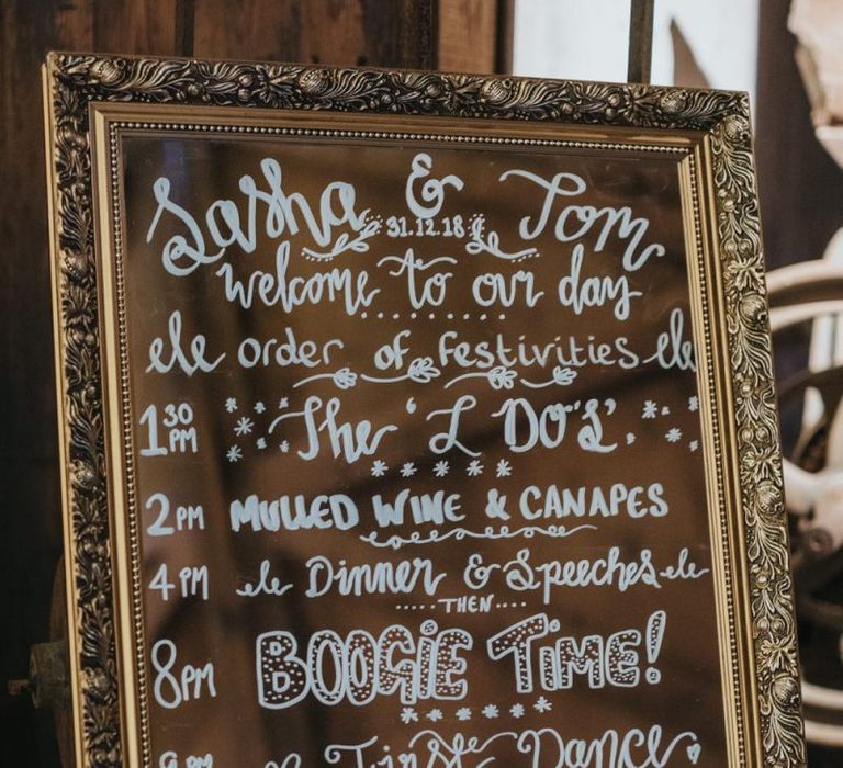 Mirror wedding sign with white writing for winter celebration with opulent colours and sparkle