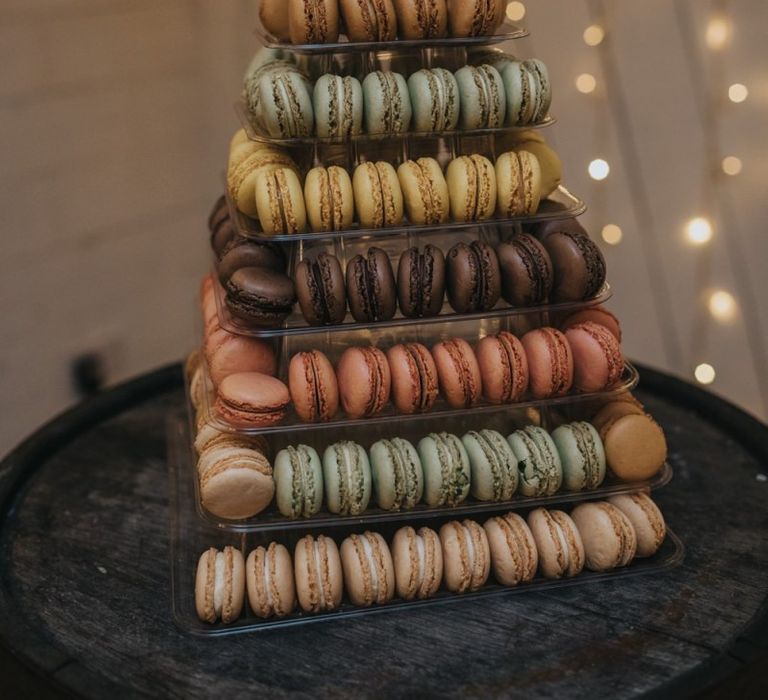 Macaroon tower cake at winter reception for New Years celebration with fairy lights