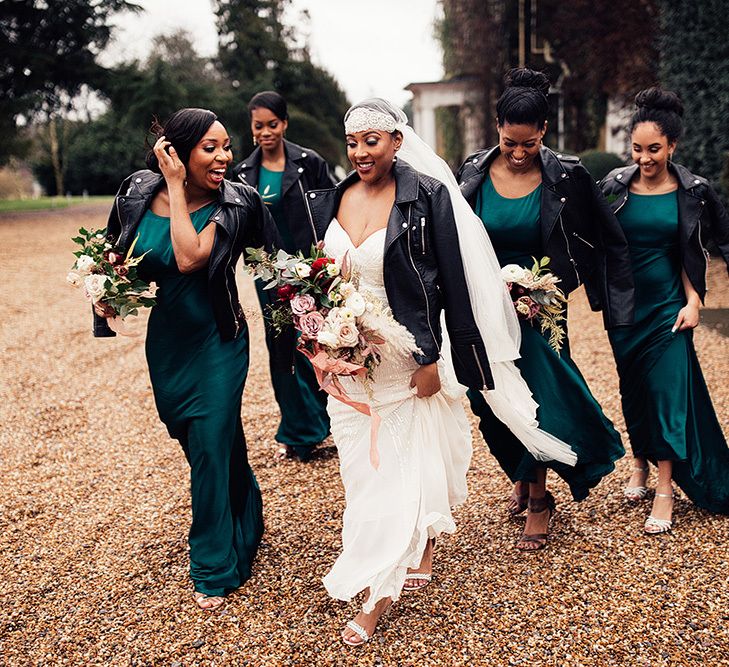 Bridal Party Portrait with Black Bride in Juliet Cap Veil, Eliza Jane Howell Wedding Dress and Leather Jacket and Bridesmaids in Emerald Green Satin Dresses with Leather Jackets