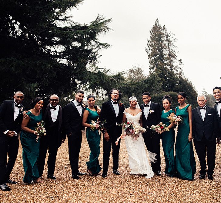 Black Wedding Party Portrait in Tuxedos and Emerald Green Dresses