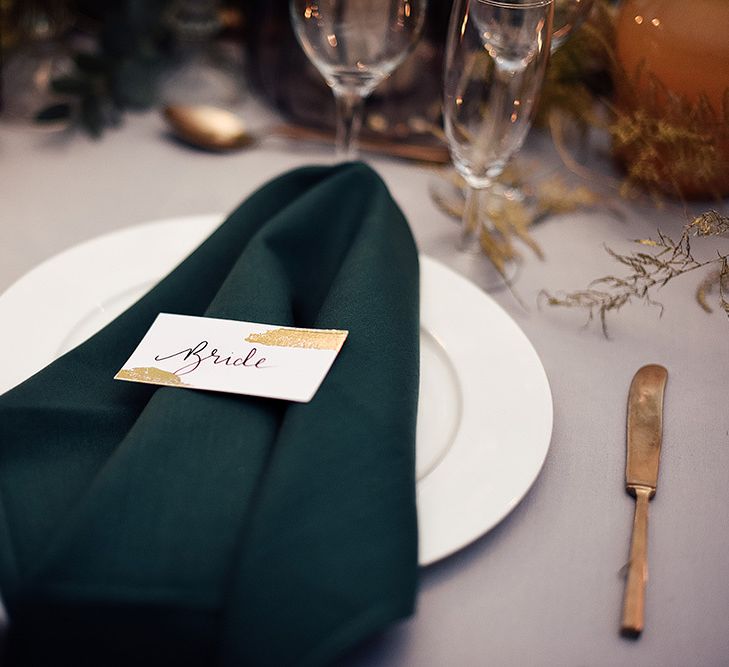 Place Setting with Emerald Green Napkin and White and Gold Name Place Card