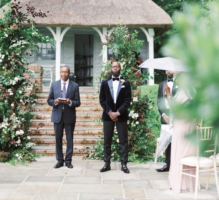 Groom standing at the altar in a tuxedo