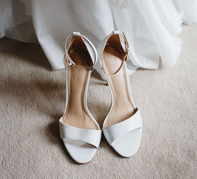 White Carvela Heels with Ankle Strap | Lace Fishtail Gown with Strapless Sweetheart Neckline by Suzanne Neville | Peg Board Table Plan &amp; DIY Sweet Table for an Elmore Court Wedding | Mavric Photography