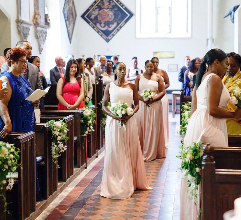 Bridesmaids in Blush Pink One Shoulder Dresses by Vera Wang | Bouquets of White and Blush Roses and Peonies | Rose and Peony Pew Ends | Wedding Ceremony at St John the Baptist Church, Elmore | Peg Board Table Plan &amp; DIY Sweet Table for an Elmore Court Wedding | Mavric Photography