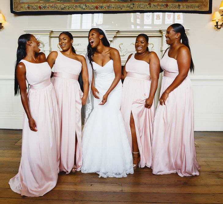 Bride in Lace Fishtail Gown with Strapless Sweetheart Neckline by Suzanne Neville | Lace Edged Cathedral Length Veil | Bridesmaids in Blush Pink One Shoulder Dresses by Vera Wang | Peg Board Table Plan &amp; DIY Sweet Table for an Elmore Court Wedding | Mavric Photography