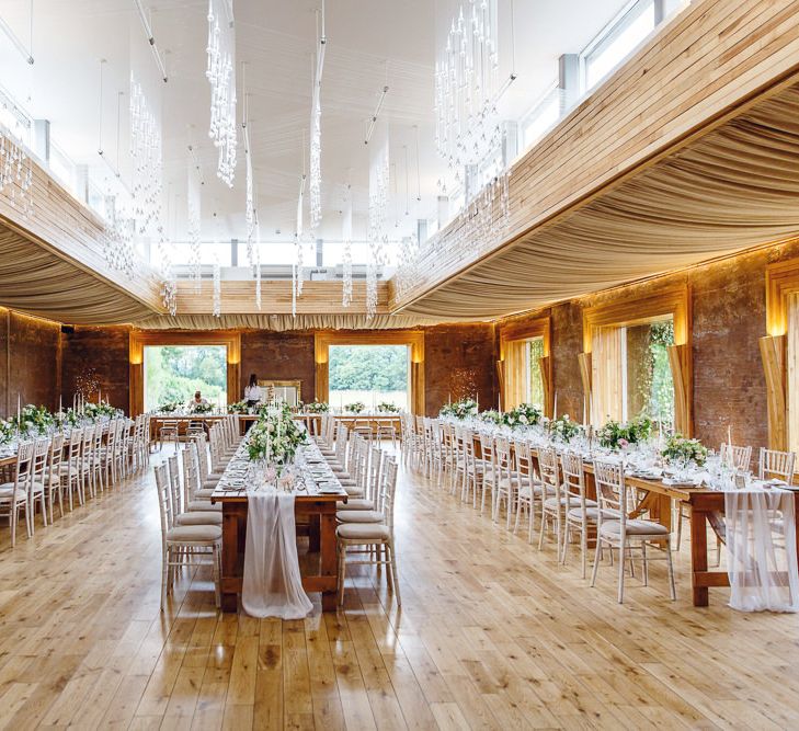 Banquet Tables | Soft White Table Runners | White Tapered Candles | Gold Candlestick Holders | Rose and Peony Centrepieces | Bud Vases | Wedding Reception in The Gillyflower at Elmore Court | Peg Board Table Plan &amp; DIY Sweet Table for an Elmore Court Wedding | Mavric Photography