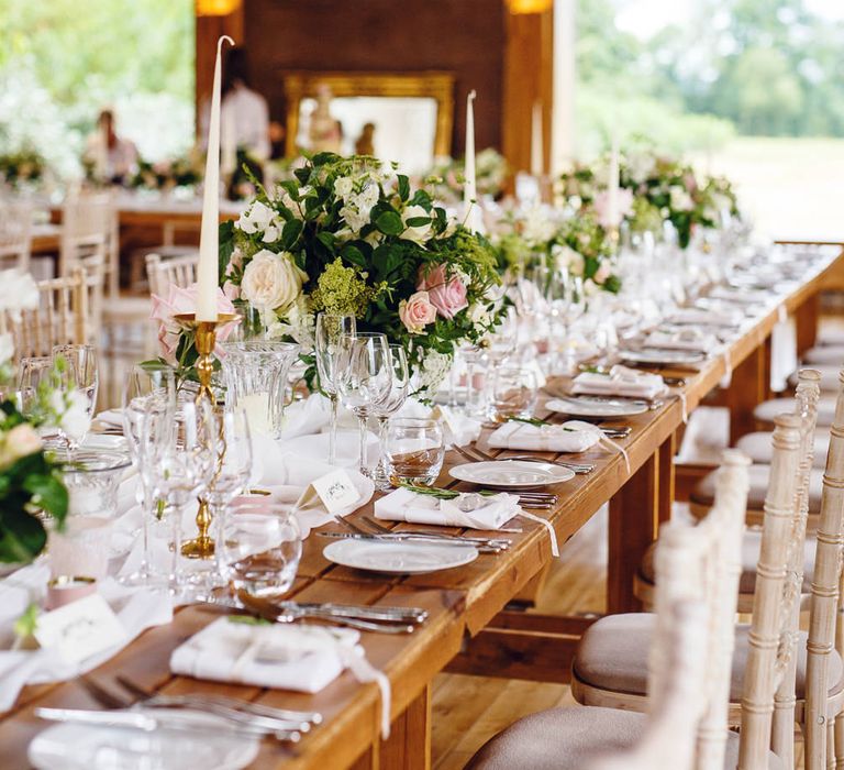 Banquet Tables | Soft White Table Runners | White Tapered Candles | Gold Candlestick Holders | Rose and Peony Centrepieces | Bud Vases | Wedding Reception in The Gillyflower at Elmore Court | Peg Board Table Plan &amp; DIY Sweet Table for an Elmore Court Wedding | Mavric Photography