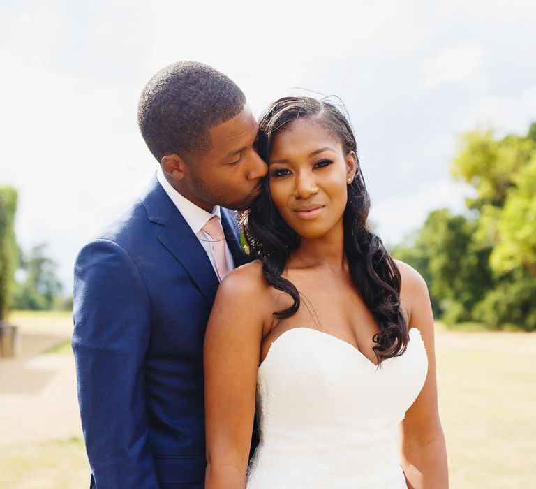 Bride in Lace Fishtail Gown with Strapless Sweetheart Neckline by Suzanne Neville | Groom in Blue Three-Piece Ted Baker Suit with Blush Pink Tie | Peg Board Table Plan &amp; DIY Sweet Table for an Elmore Court Wedding | Mavric Photography