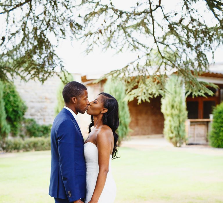 Bride in Lace Fishtail Gown with Strapless Sweetheart Neckline by Suzanne Neville | Groom in Blue Three-Piece Ted Baker Suit with Blush Pink Tie | Peg Board Table Plan &amp; DIY Sweet Table for an Elmore Court Wedding | Mavric Photography