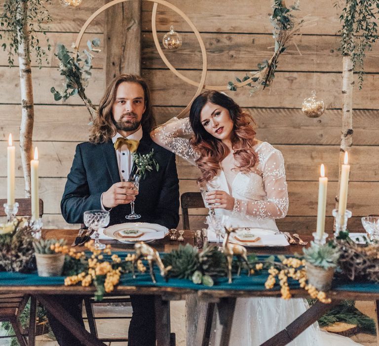 Bride &amp; Groom Sweetheart Table with Hoop Backdrop | Taper Candles | Vintage Crockery &amp; Cut Glass | Geometric Wedding Decor &amp; Styling by Locate to Create at The Cherry Barn | Rebecca Carpenter Photography