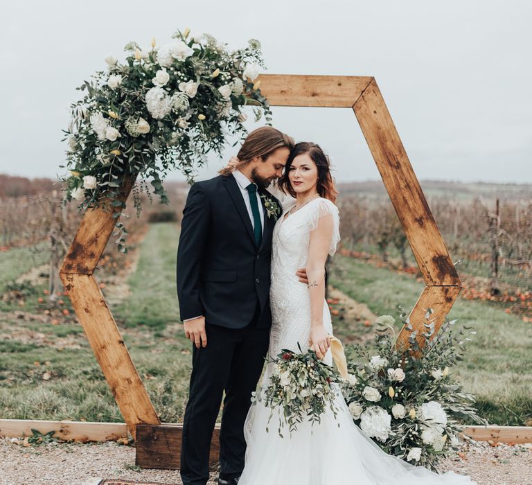 Wooden Hexagonal Moon Gate | Geometric Wedding Decor &amp; Styling by Locate to Create at The Cherry Barn | Rebecca Carpenter Photography