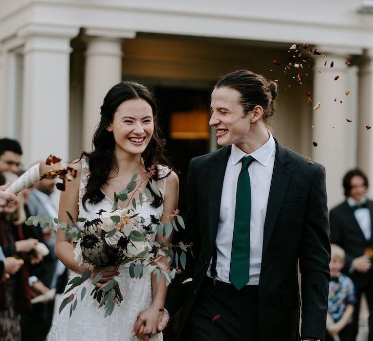 Confetti moment for bride and groom