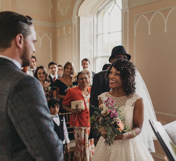 Wedding Ceremony with Bride in Polka Dot Tea Length Wedding Dress and Groom in Grey Check Suit