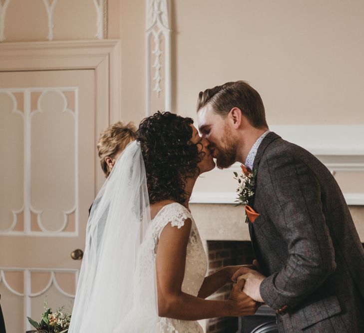 Bride and Groom Kissing at Wedding Ceremony