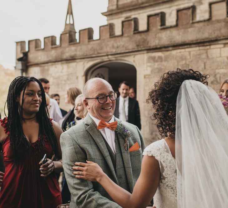 Father of the Groom in Grey Check Suit and Orange Bow Tie Congratulating the Bride