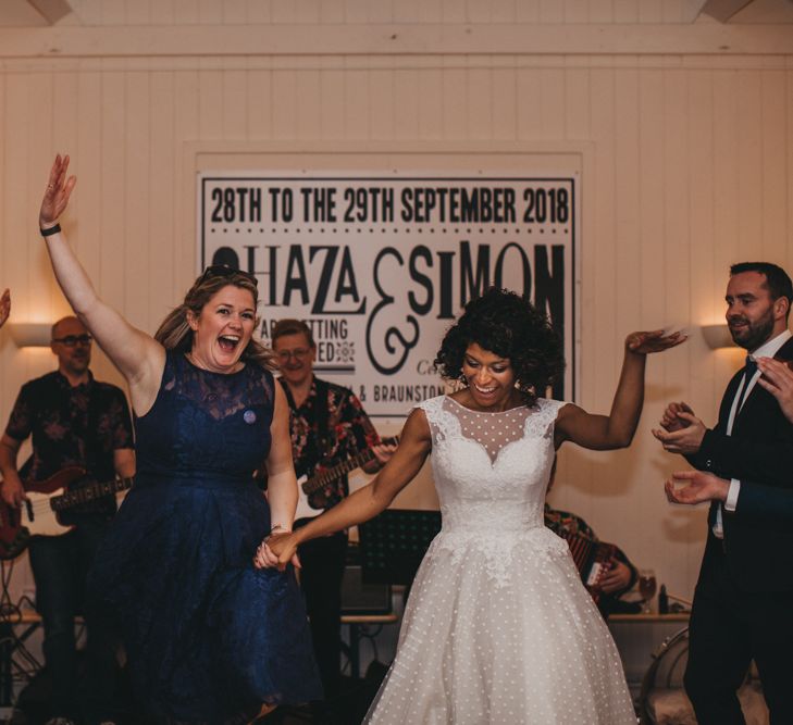 Bride and Bridesmaid Enjoying the Ceilidh Dance