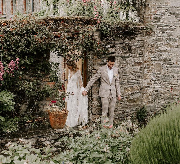 Bride and groom sneak a moment before micro wedding