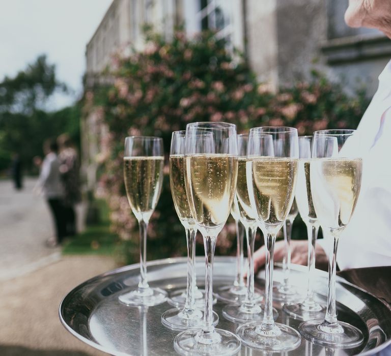 Drinks Reception with Champagne Glasses on a Silver Serving Tray